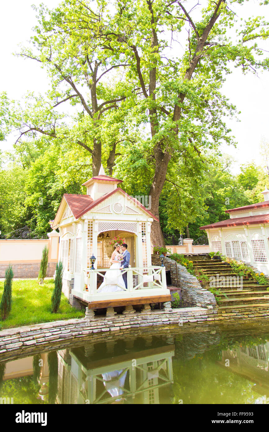 Young wedding couple enjoying romantic moments Stock Photo - Alamy