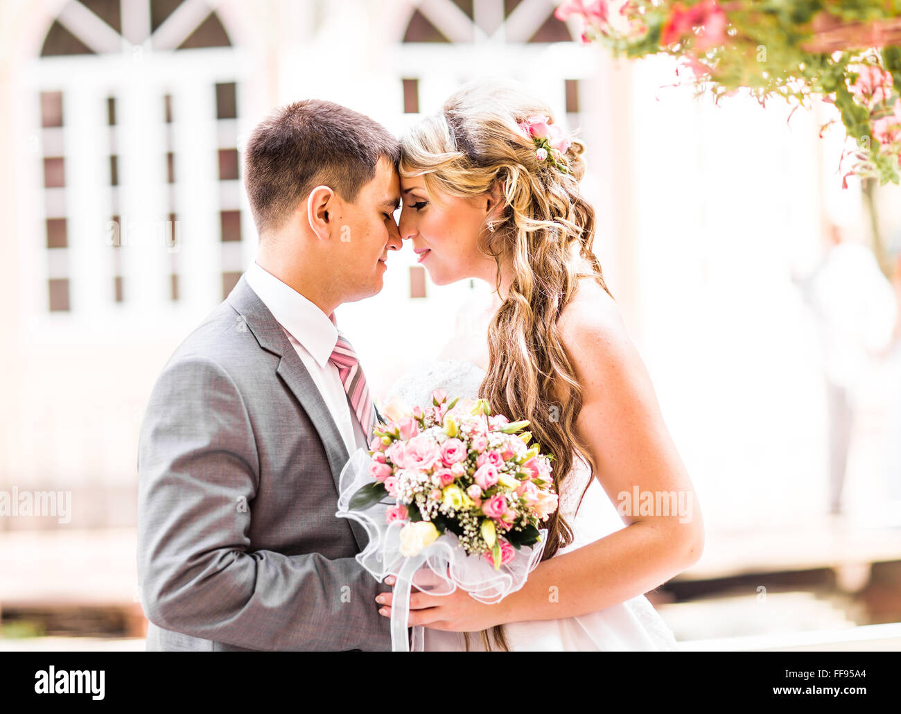 Young wedding couple enjoying romantic moments Stock Photo - Alamy