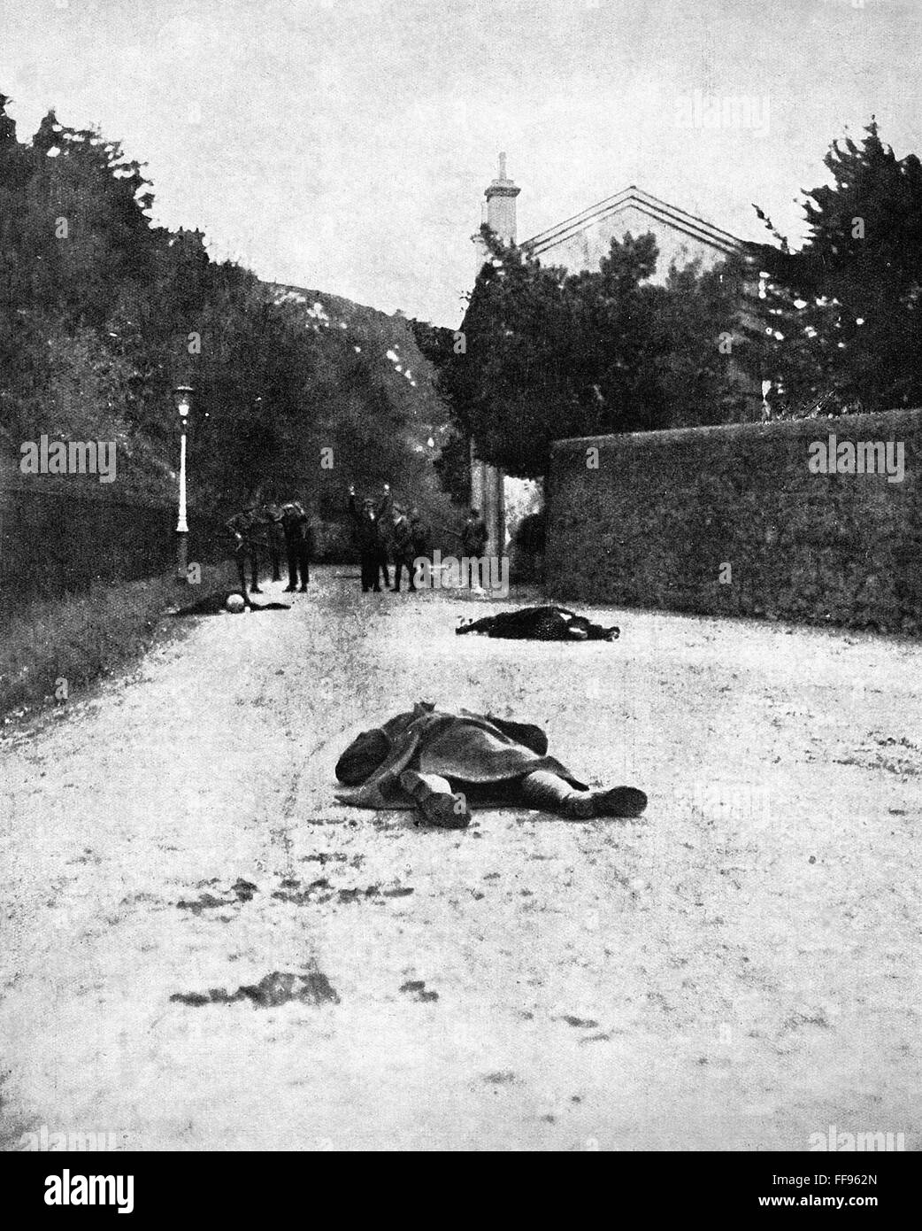 BLOODY SUNDAY, 1920. /nA wounded British cadet (foreground) and two of the three Irish Republicans killed in the 'Bloody Sunday' street battle, 21 November 1920, lie in the road as the other cadets take the remaining Republicans prisoner. Stock Photo