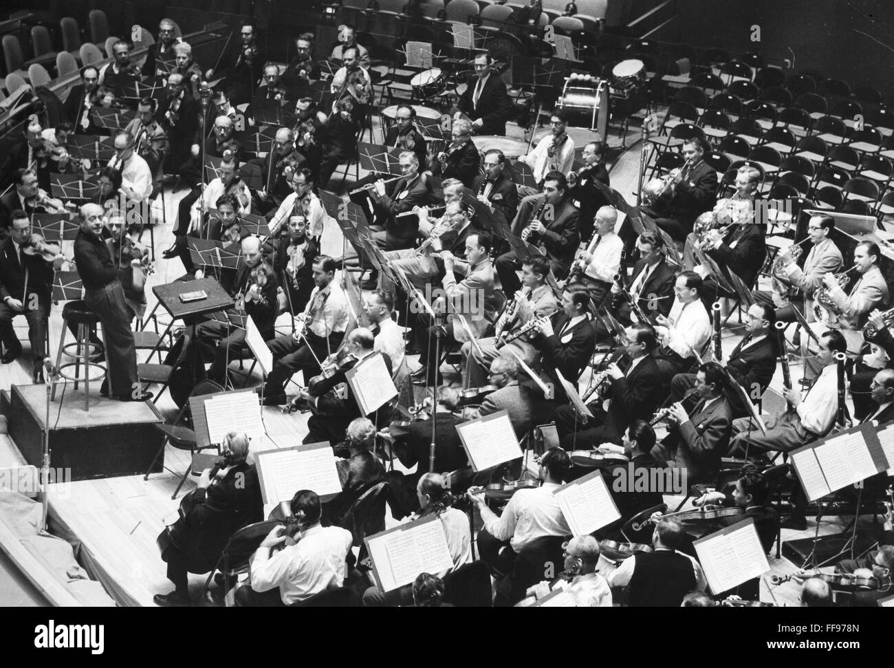 EUGENE ORMANDY (1899-1985). /nAmerican (Hungarian-born) conductor. Ormandy conducting the Philadelphia Orchestra in rehearsal at the United Nations, New York City, 1960. Stock Photo