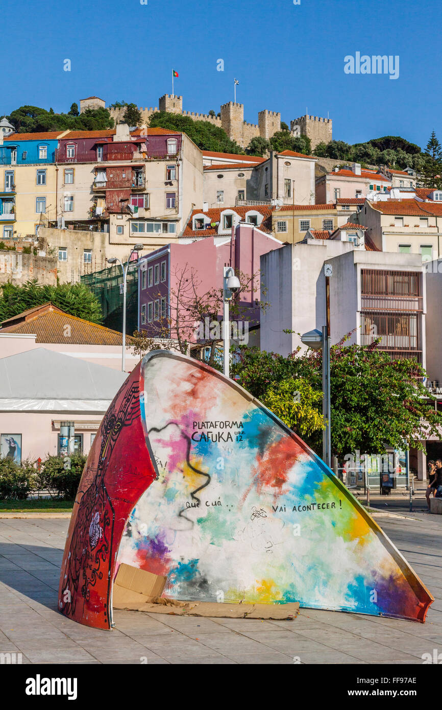 Portugal, Lisbon, large egg shell fragment instalation at Martim Moniz Square with view of Castelo de Sao Jorge Stock Photo