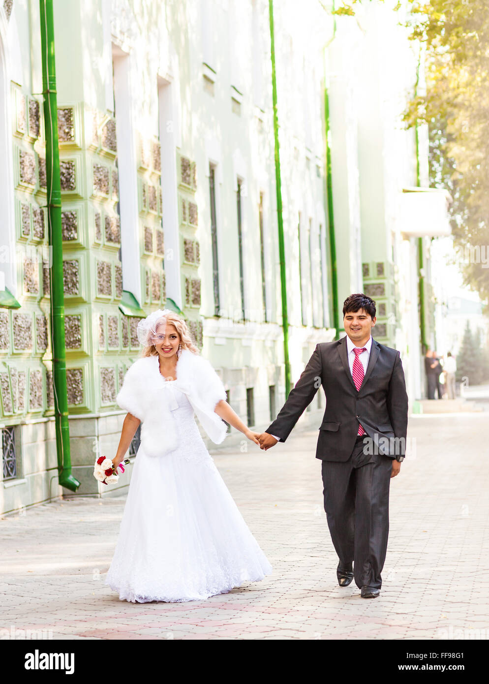 Young wedding couple enjoying romantic moments Stock Photo - Alamy