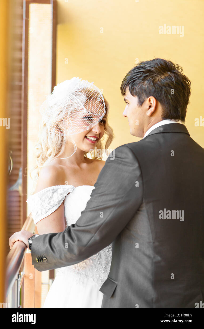 Young wedding couple enjoying romantic moments Stock Photo - Alamy