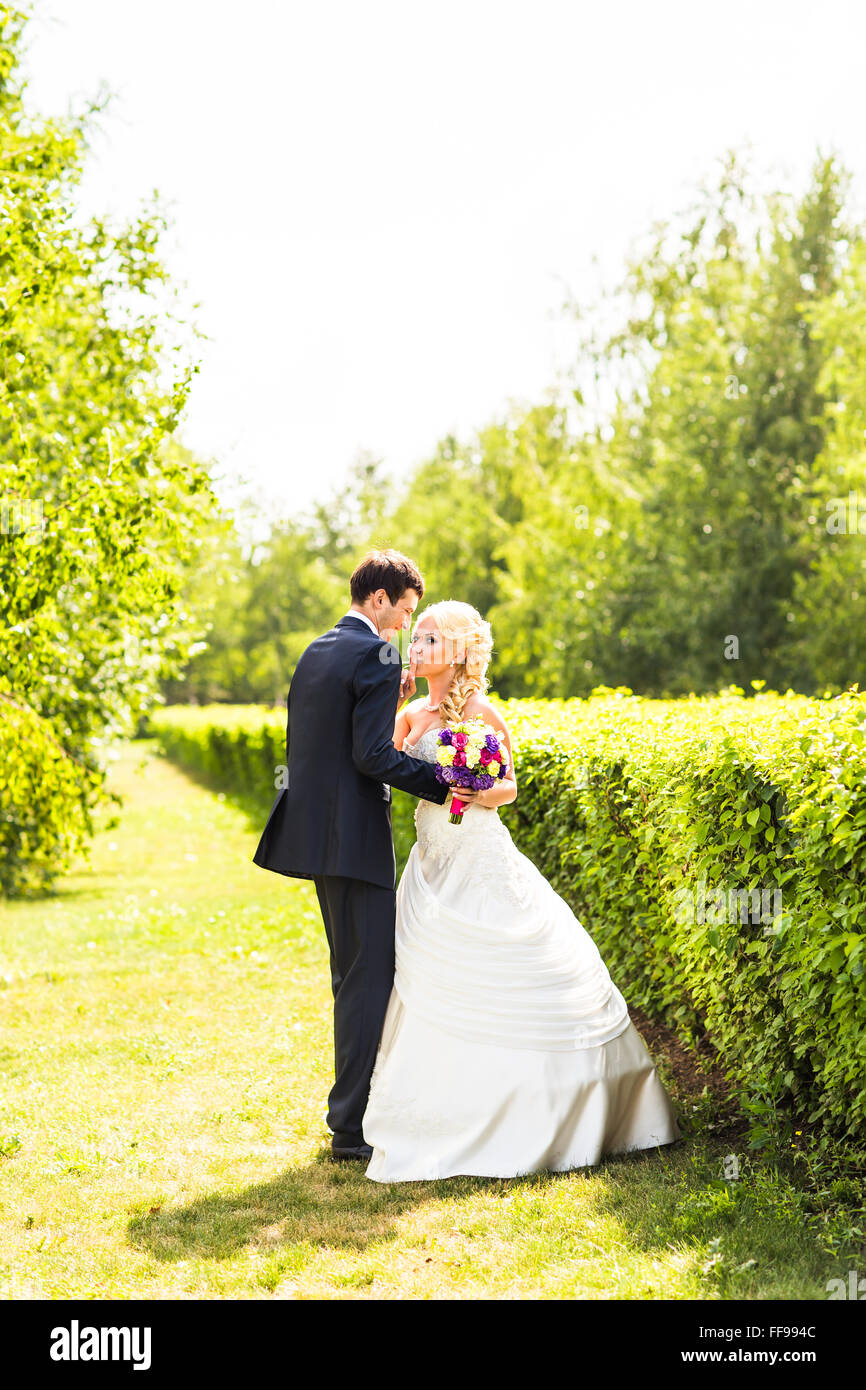 Young wedding couple enjoying romantic moments Stock Photo - Alamy