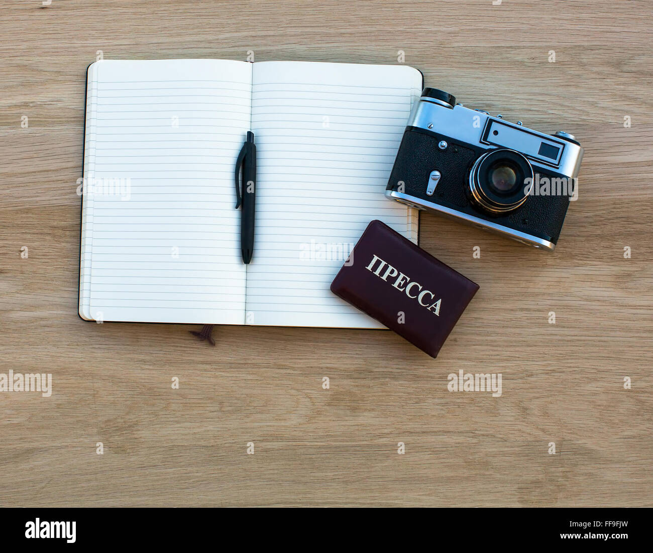 Notebook with pen, camera and Russian Press ID. Stock Photo