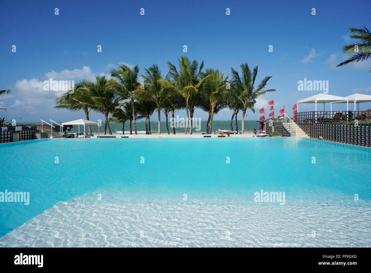 Pool, palm trees, Millenium Resort, Cabarete,  Dominican Republic Stock Photo