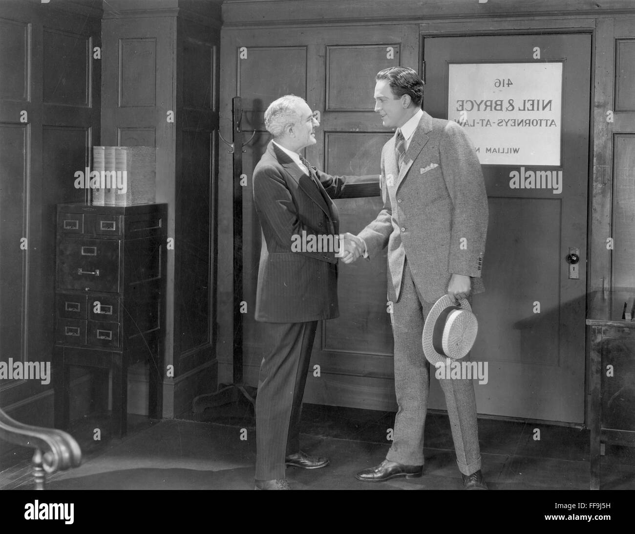 OFFICE MEETING, 1920s. /nA silent movie still, 1920s. Stock Photo