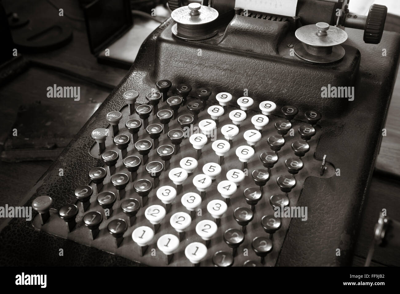 Original antique typewriter calculator in sepia tone. Horizontal Stock Photo