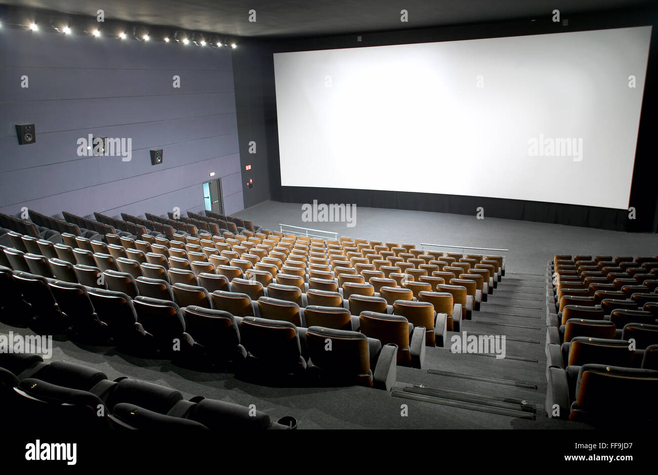Modern cinema interior with seats and screen. Horizontal Stock Photo