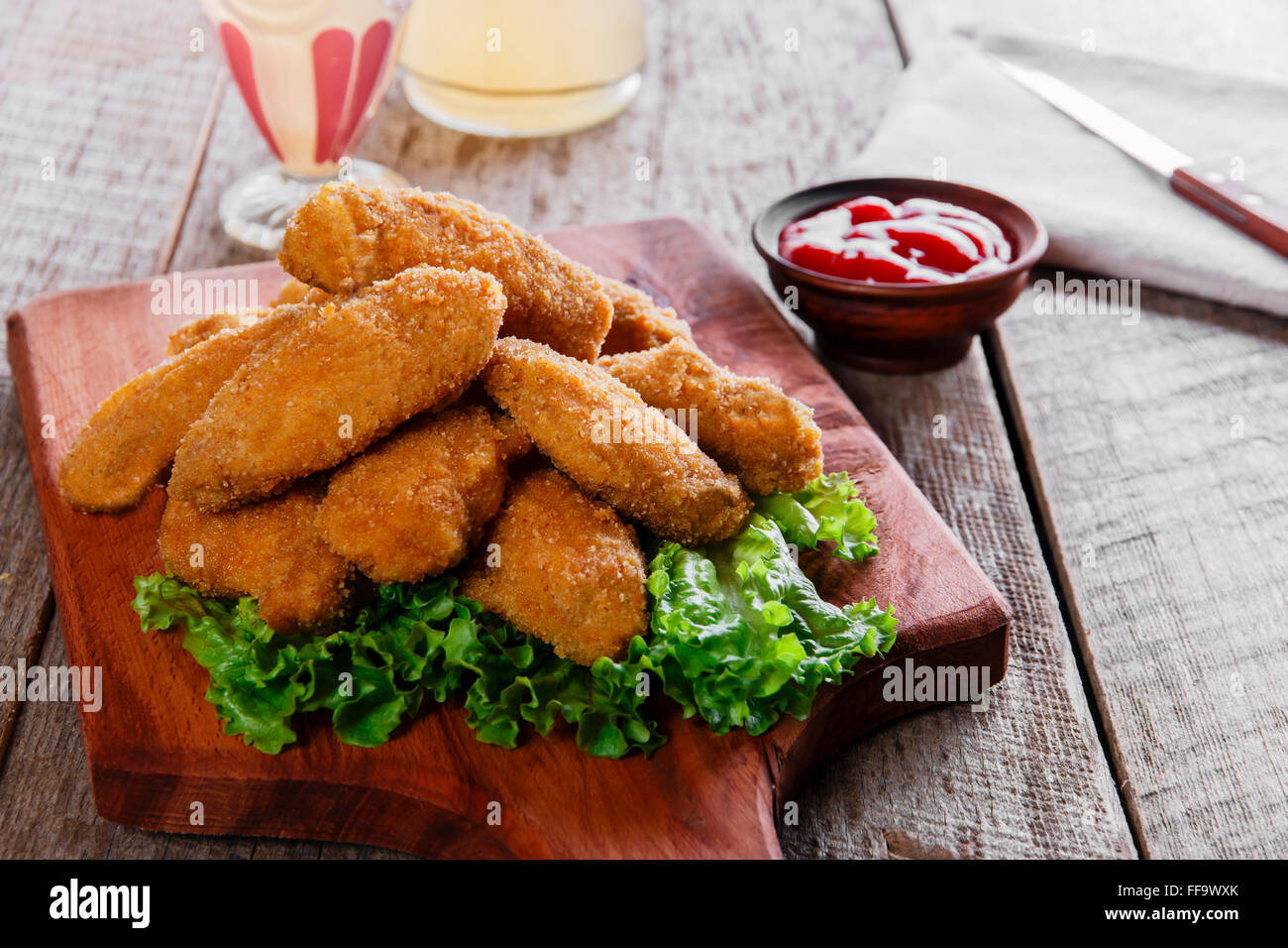 chicken wings fried in breadcrumbs with sauce Stock Photo