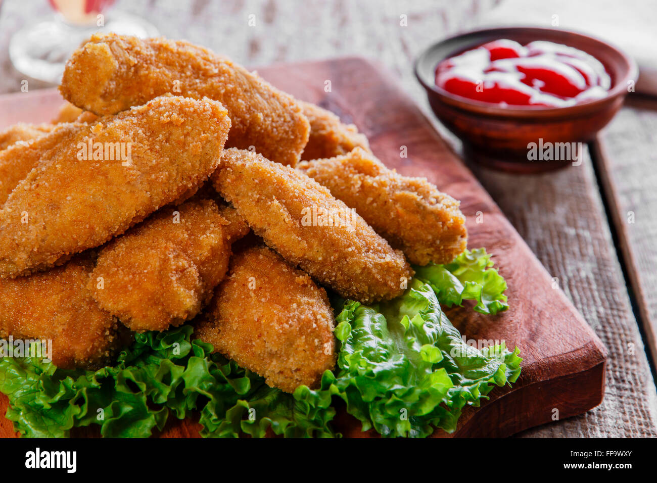 chicken wings fried in breadcrumbs with sauce Stock Photo