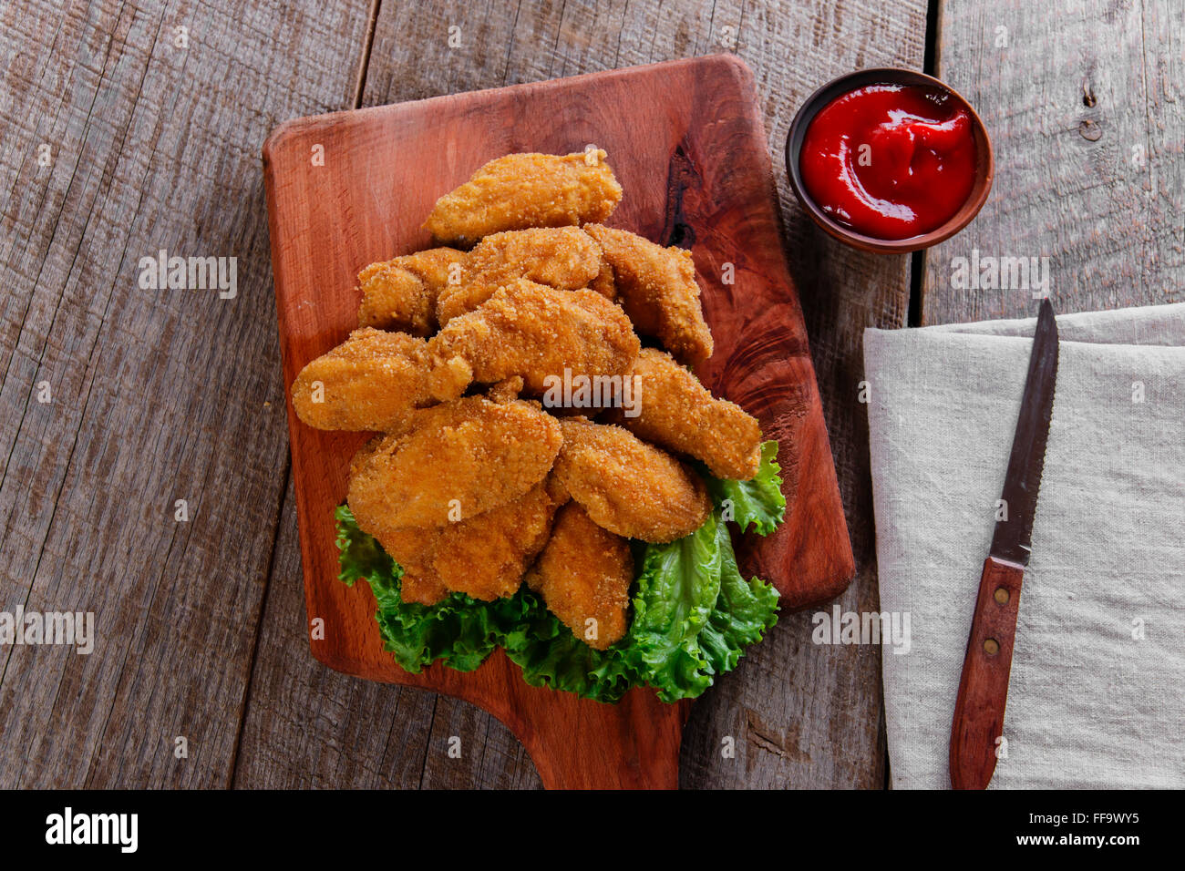 chicken wings fried in breadcrumbs with sauce Stock Photo