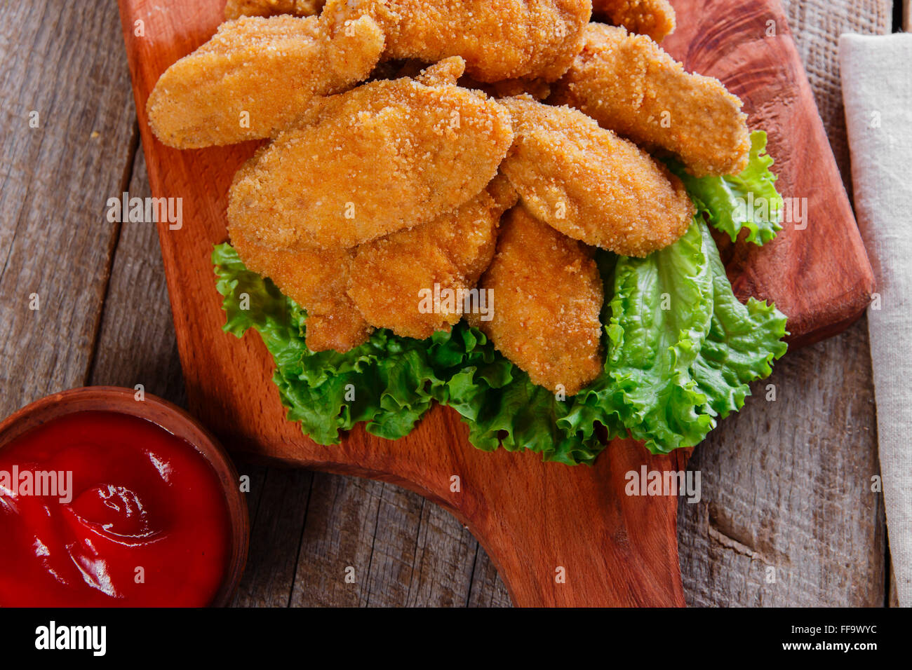 chicken wings fried in breadcrumbs with sauce Stock Photo