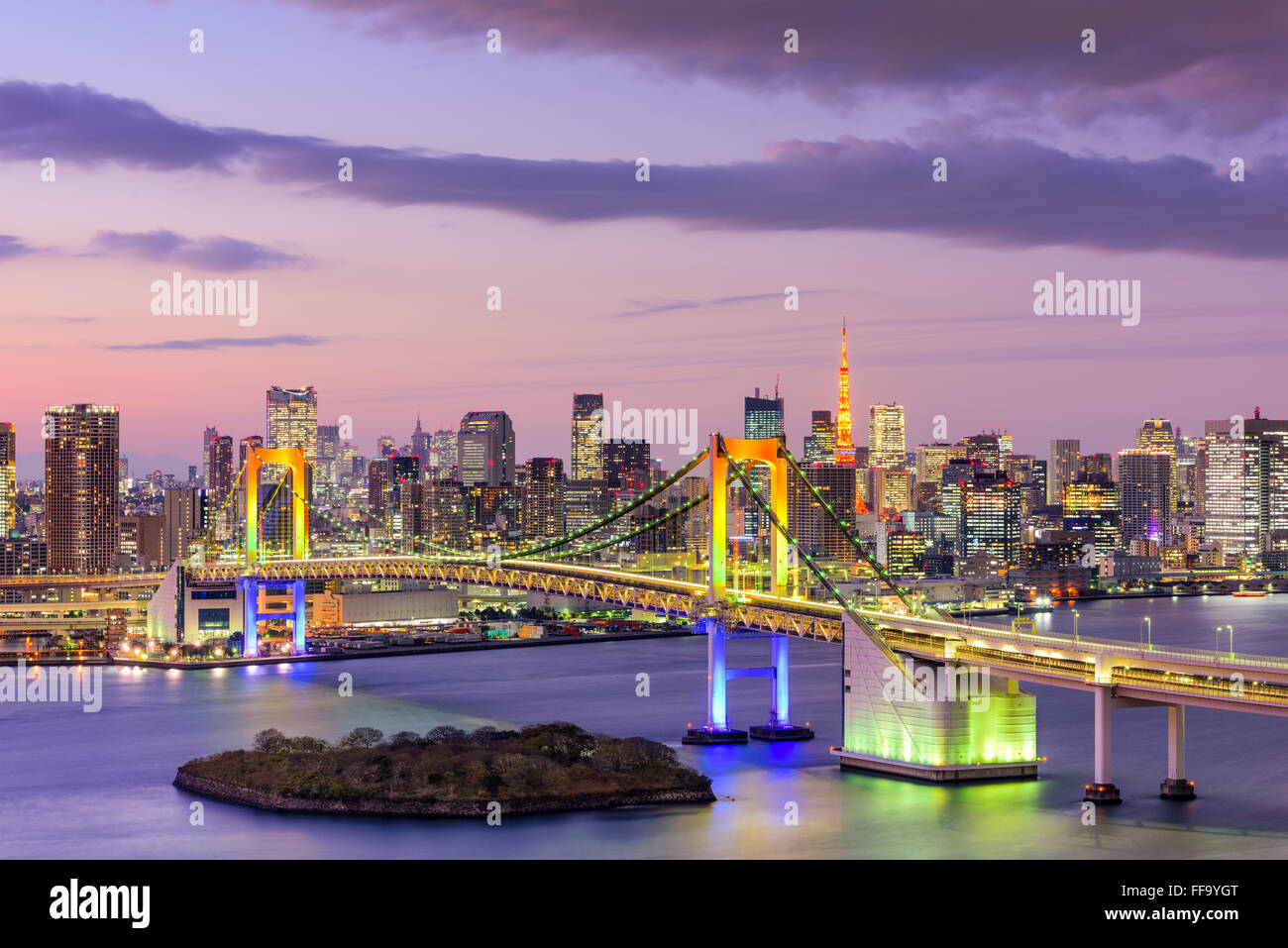 Tokyo, Japan skyline with Rainbow Bridge and Tokyo Tower. Stock Photo