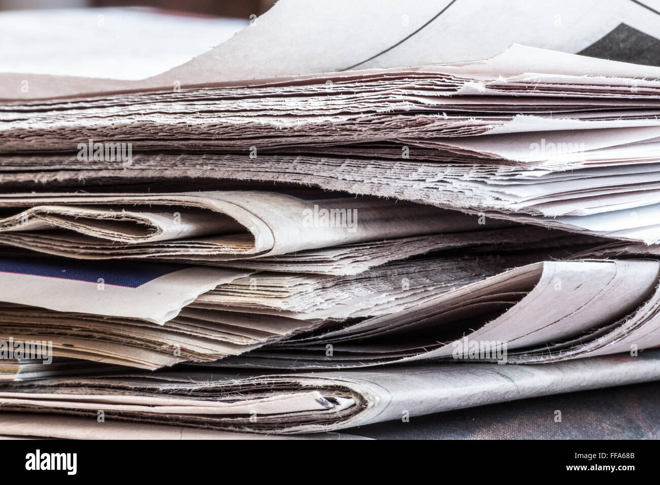 Extreme closeup of stack of newspapers Stock Photo