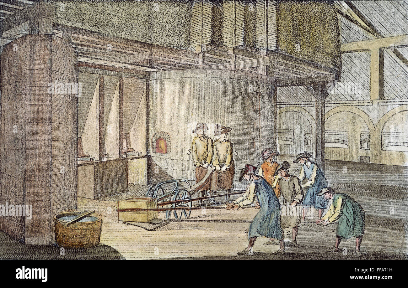 GLASSMAKING, 18th CENTURY. /nA ladle of molten glass, ready to pour for the  manufacture of plate glass, is pulled out of the furnace onto a carriage:  line engraving, French, 18th century Stock