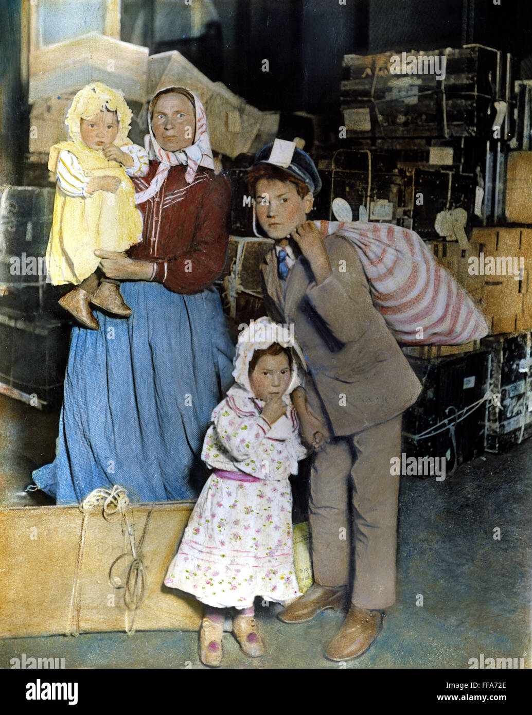AN IMMIGRANT FAMILY /nat Ellis Island, c. 1905. Oil over a photograph. Stock Photo