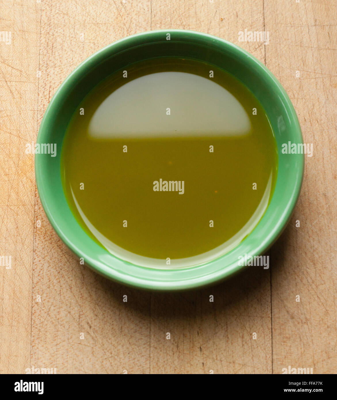 Mustard oil in a green bowl. Stock Photo