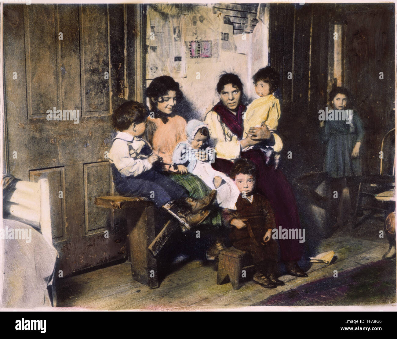 CHICAGO: IMMIGRANTS. /nAn Italian immigrant family in their Chicago home. Oil over a photograph, 1910, by Lewis W. Hine. Stock Photo