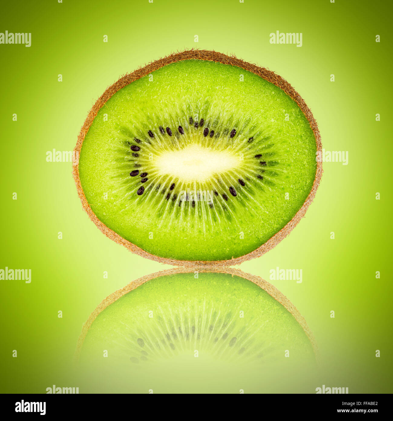 kiwi fruit slice on green background, Stock Photo