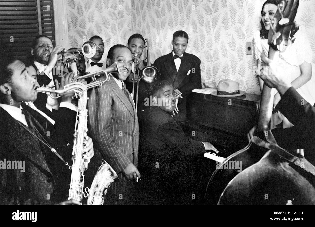 COUNT BASIE (19041984). /nAmerican musician and orchestra leader. Basie (center) with Don Byas