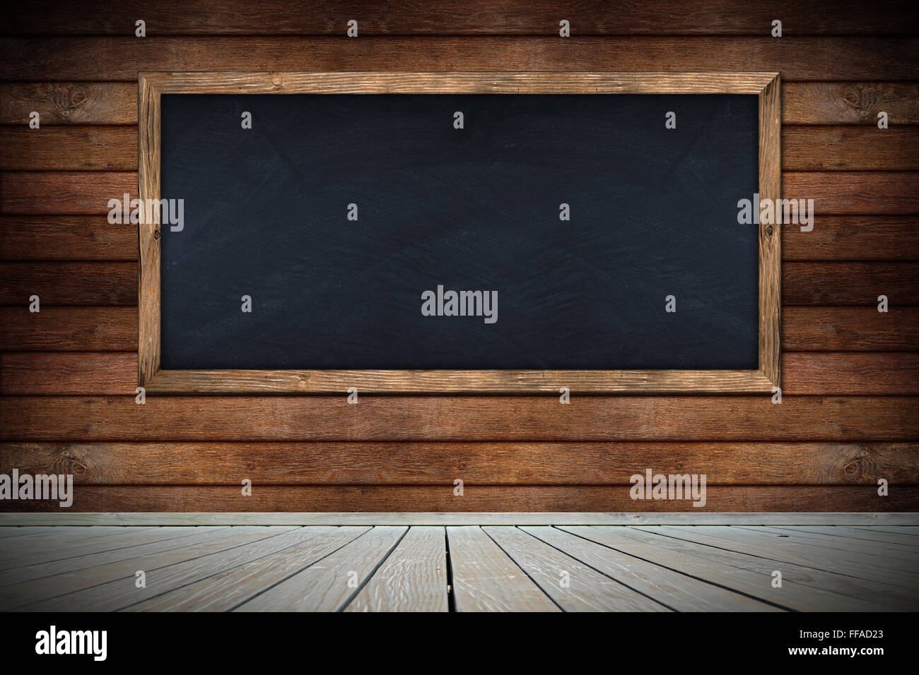 blackboard on wooden wall with floor Stock Photo