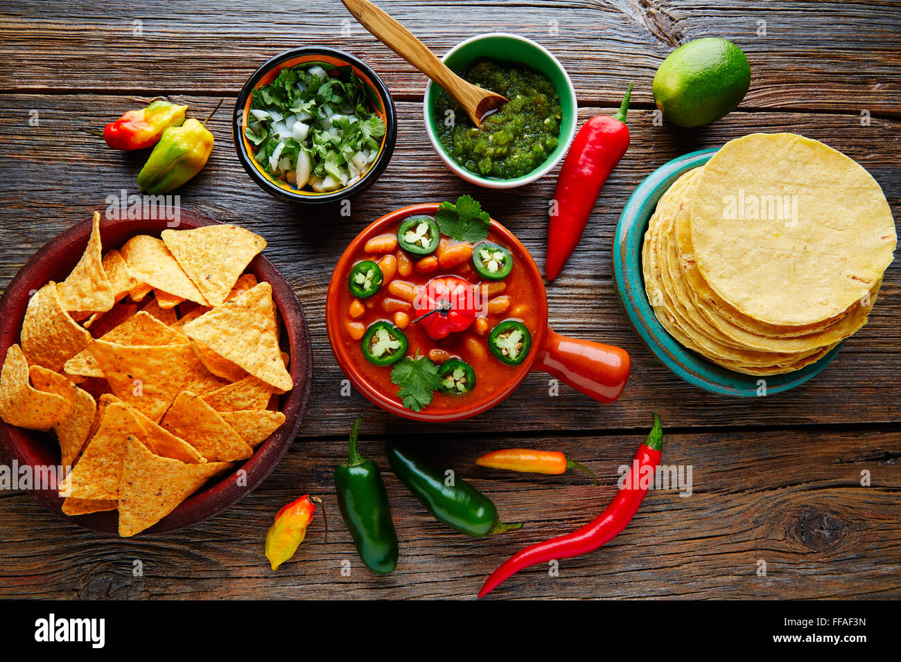 Frijoles charros mexican beans with chili pepper sides and tortillas Stock Photo