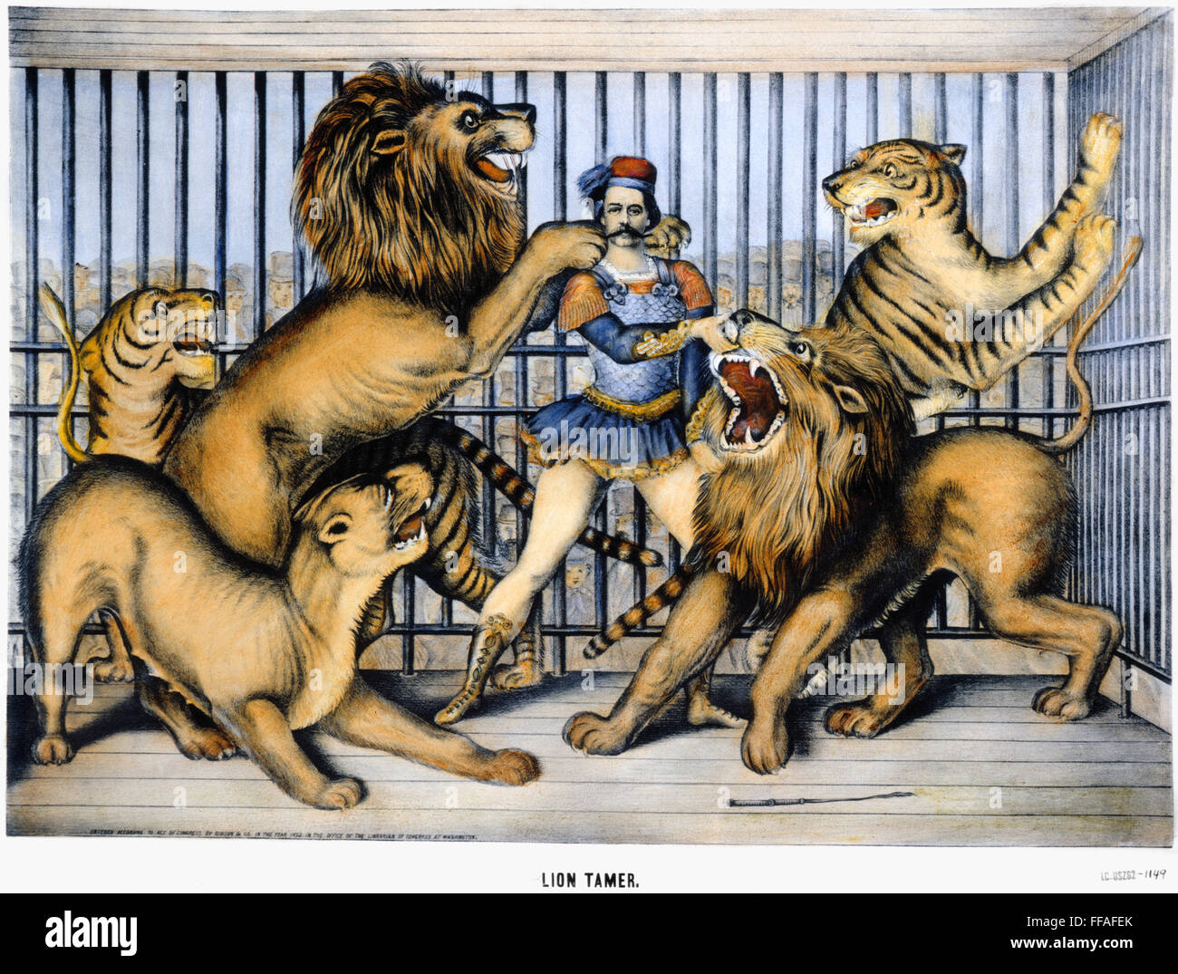 LION TAMER, 1873./nA fearless lion tamer. Lithograph, American, 1873. Stock Photo