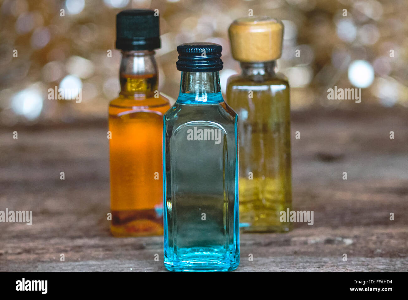 Three Colorful Minibar Bottles of Alcohol Stock Photo