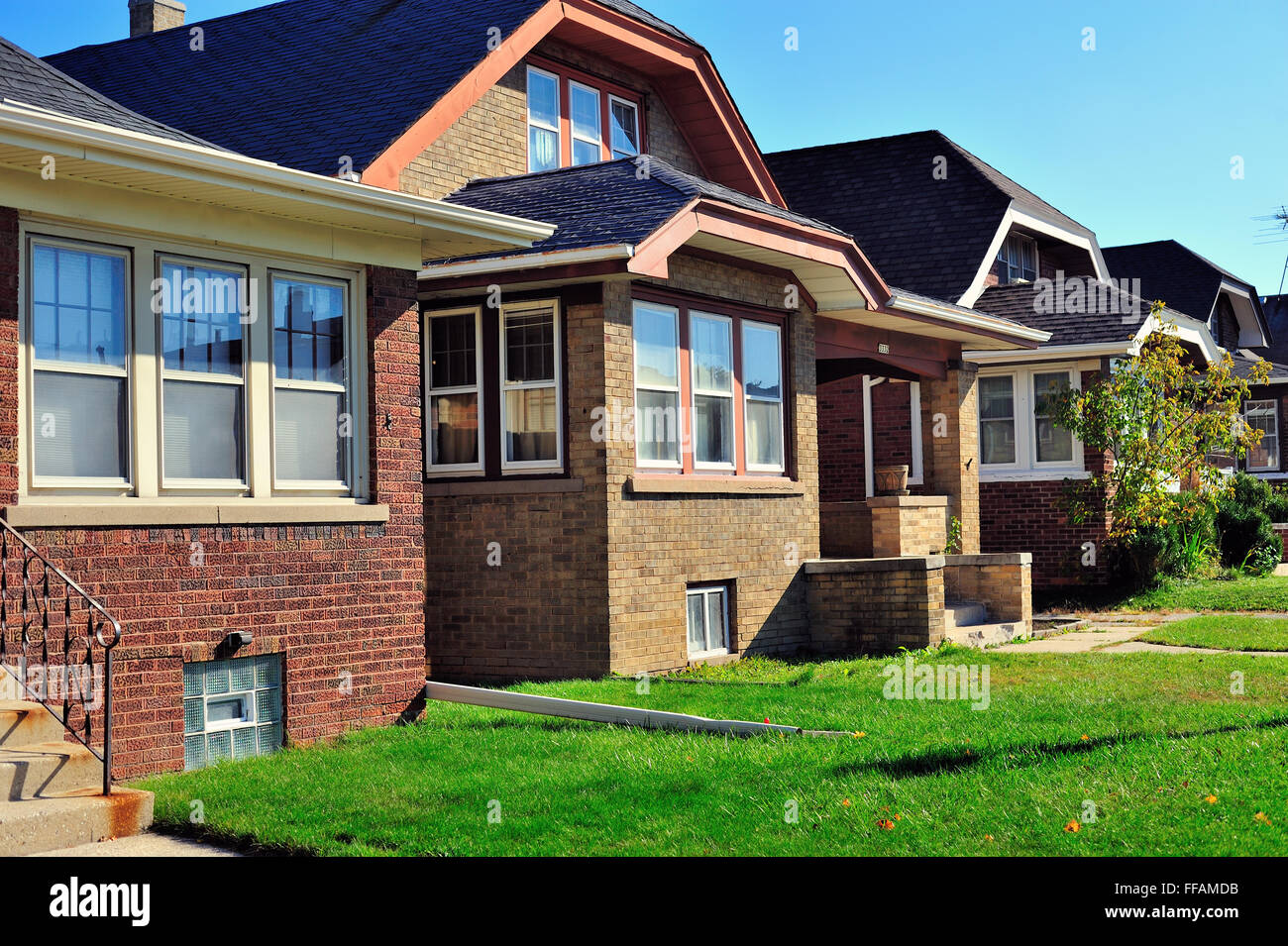 Row of bungalow-styled homes that are typical of many neighborhoods in Milwaukee, Wisconsin, USA. Stock Photo