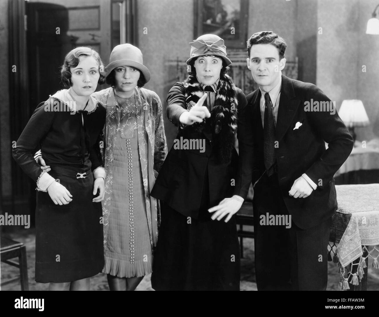 VOICE OF THE CITY, 1929. /nAlice Moe (pointing) in a scene from the film. Stock Photo