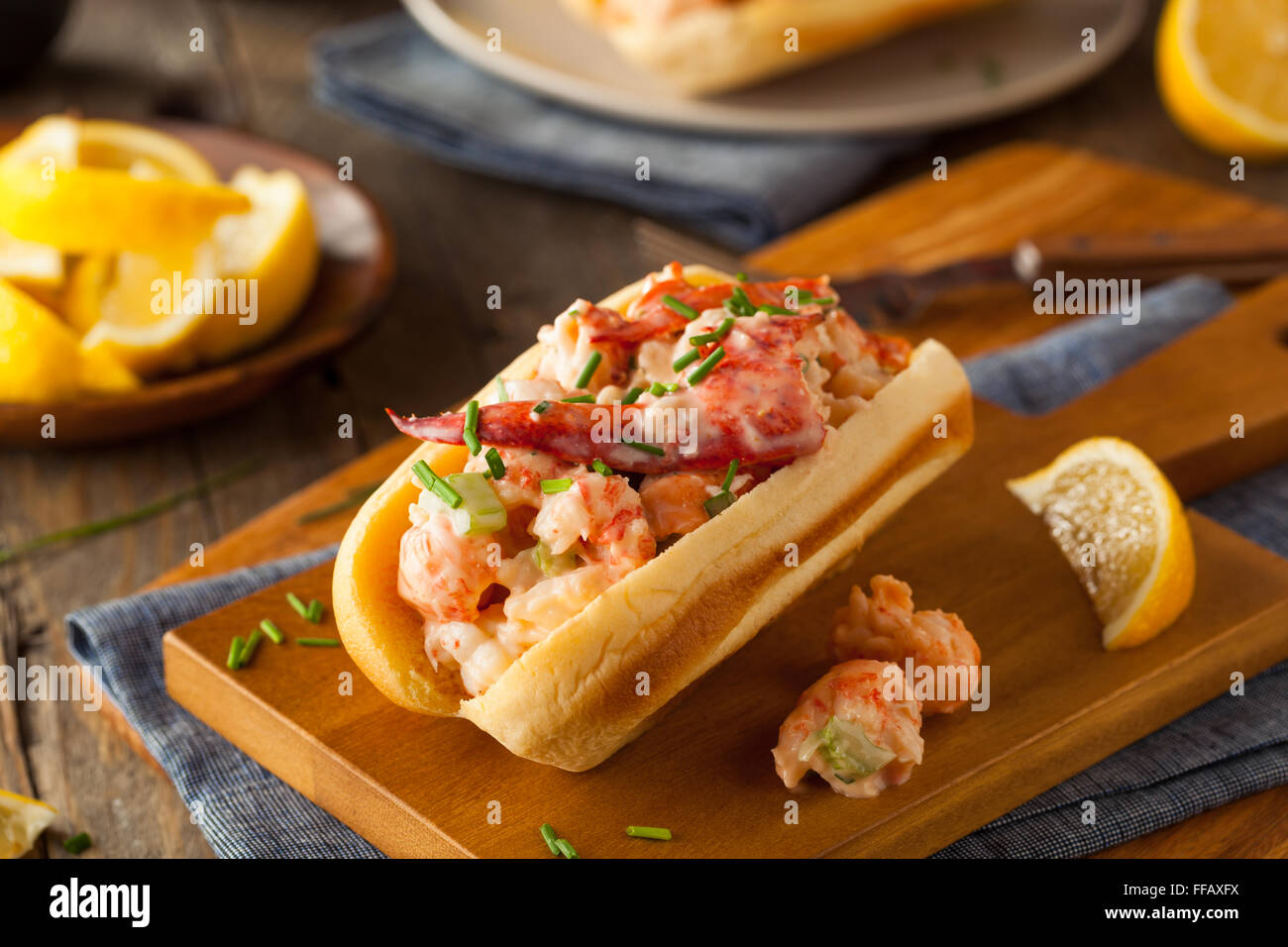 Homemade New England Lobster Roll with Lemons Stock Photo