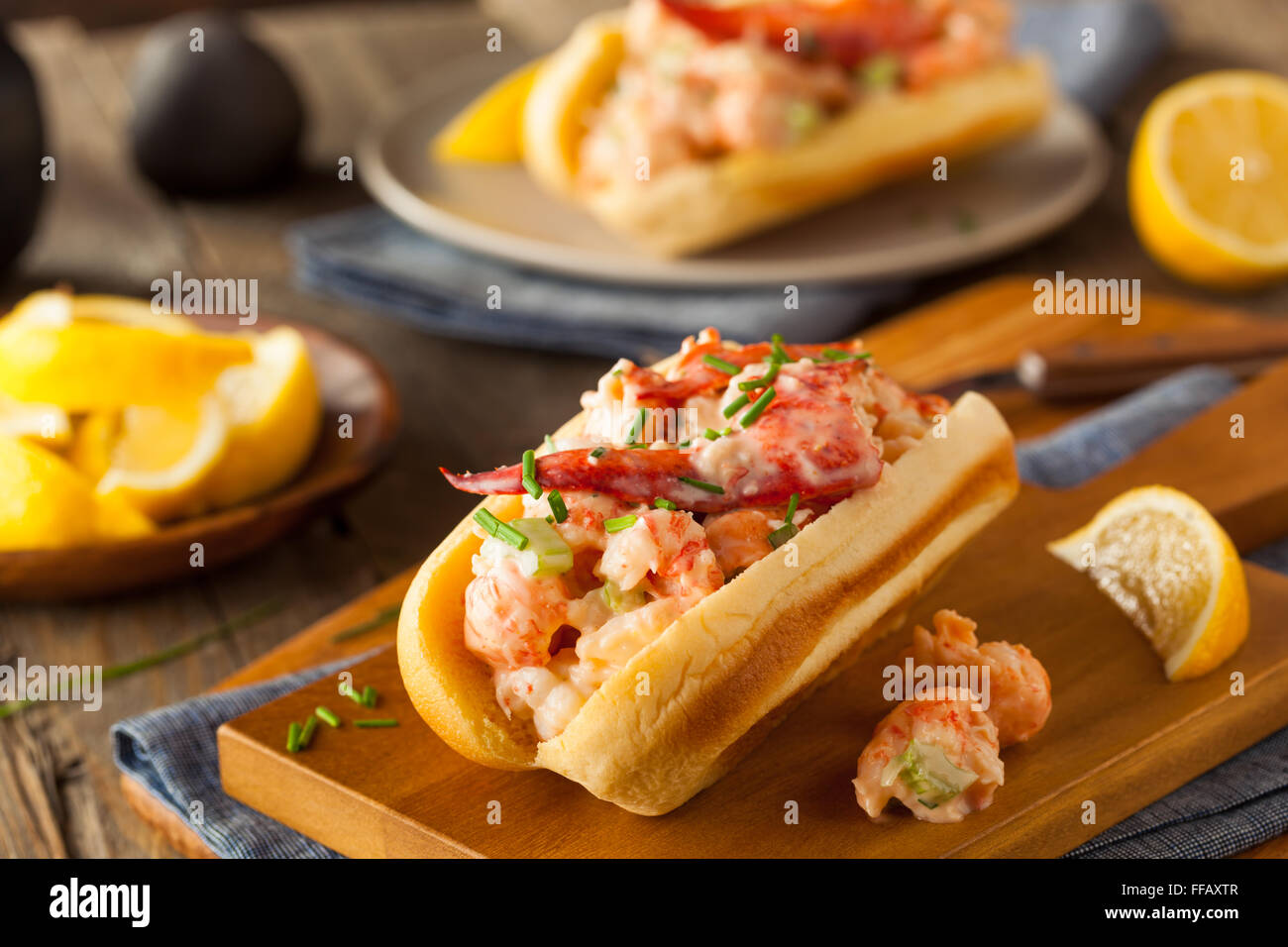 Homemade New England Lobster Roll with Lemons Stock Photo
