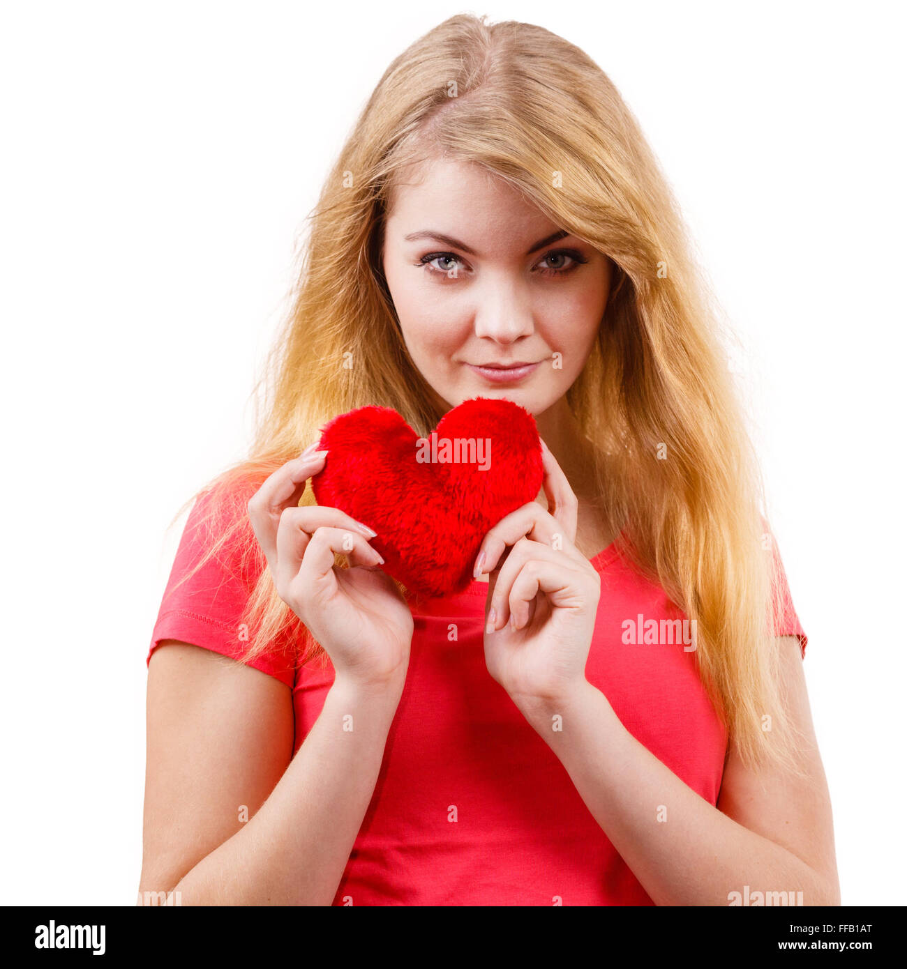 Woman blonde long hair girl holding red heart love symbol studio shot isolated on white. Valentines day happiness concept Stock Photo