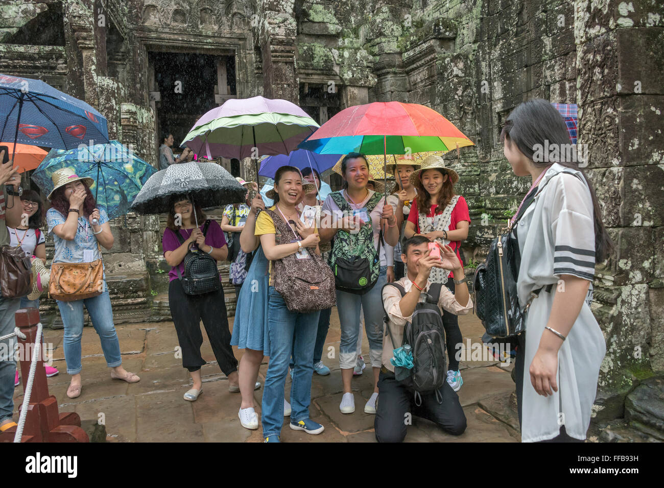 Tourists at Bayon Temple, Angkor Thom, Siem Reap, Cambodia Stock Photo