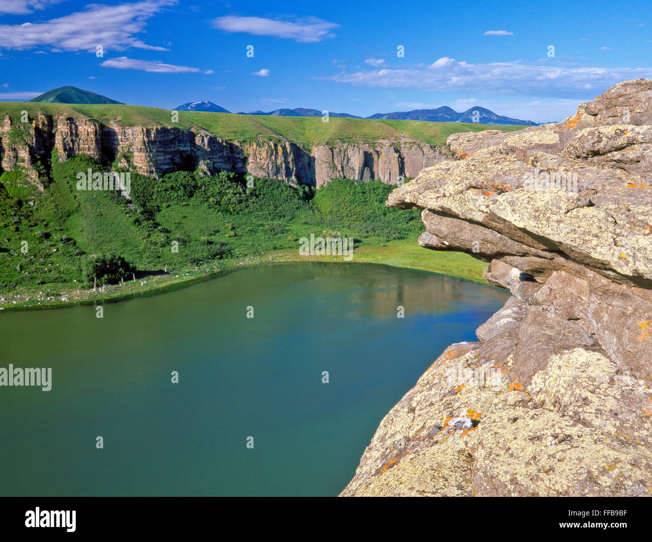 lost lake and cliffs below the highwood mountains near geraldine, montana Stock Photo
