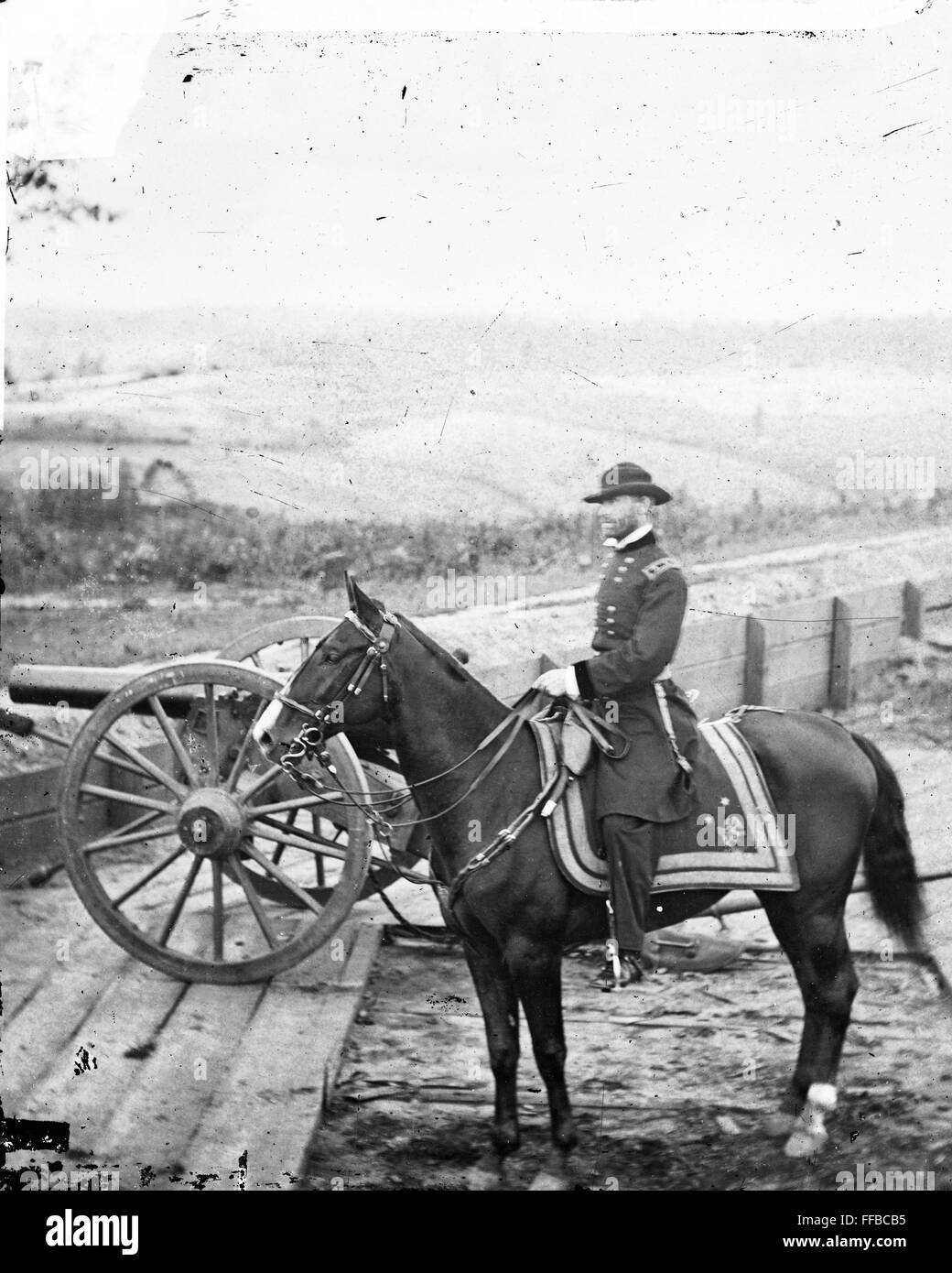 Gen. William T. Sherman on horseback at Federal Fort No. 7-Atlanta, Ga. .Photograph of the War in the West. These photographs are of Sherman in Atlanta, September-November, 1864. After three and a half months of incessant maneuvering and much hard fighting, Sherman forced Hood to abandon the munitions center of the Confederacy. Sherman remained there, resting his war-worn men and accumulating supplies, for nearly two and a half months. During the occupation, George N. Barnard, official photographer of the Chief Engineer's Office, made the best documentary record of the war in the West. Stock Photo