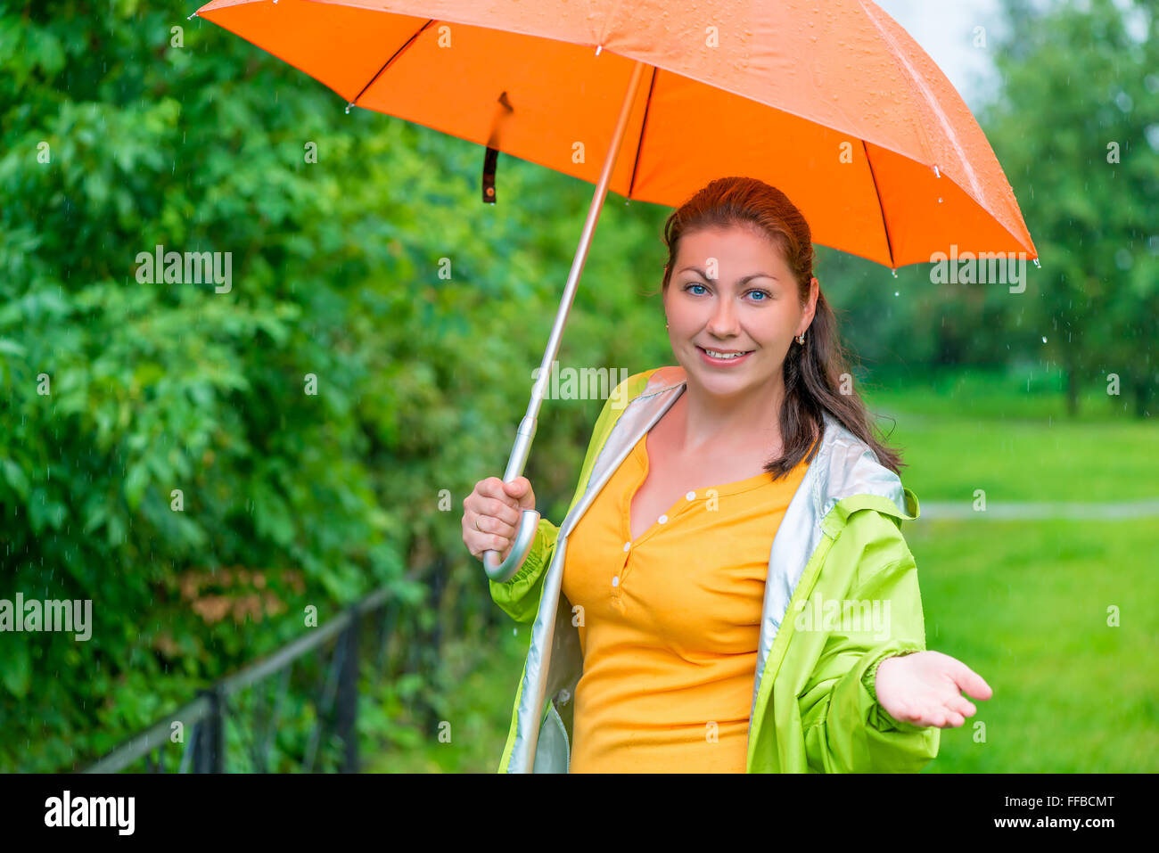 portrait of a girl with an umbrella in rainy weather Stock Photo - Alamy