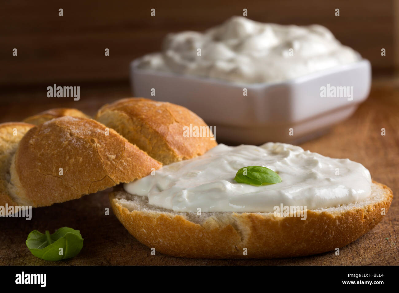 Healthy Organic Whole Grain Bagel with Cream Cheese over wooden background Stock Photo