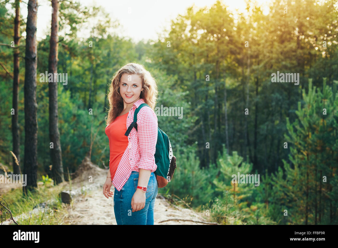 Close Up Beautiful Plus Size Young Smiling Woman In Shirt Posing In Summer Forest At Sunset Woods Background Stock Photo