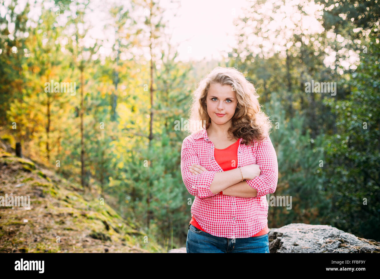 Beautiful Plus Size Young Smiling Woman In Shirt Posing In Summer Forest. Stock Photo