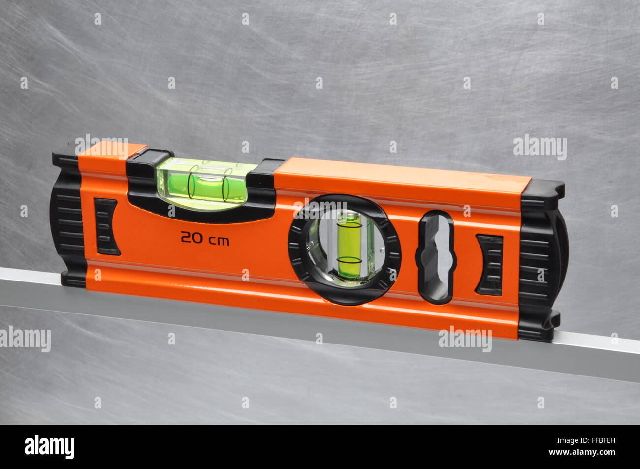 Construction tool spirit level on line of metal profile Stock Photo Alamy