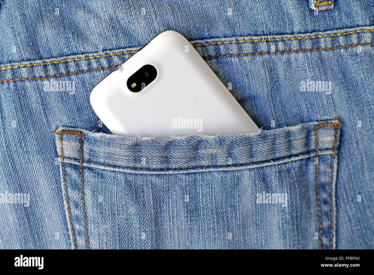 mobile smart phone in back pocket blue jeans Stock Photo Alamy
