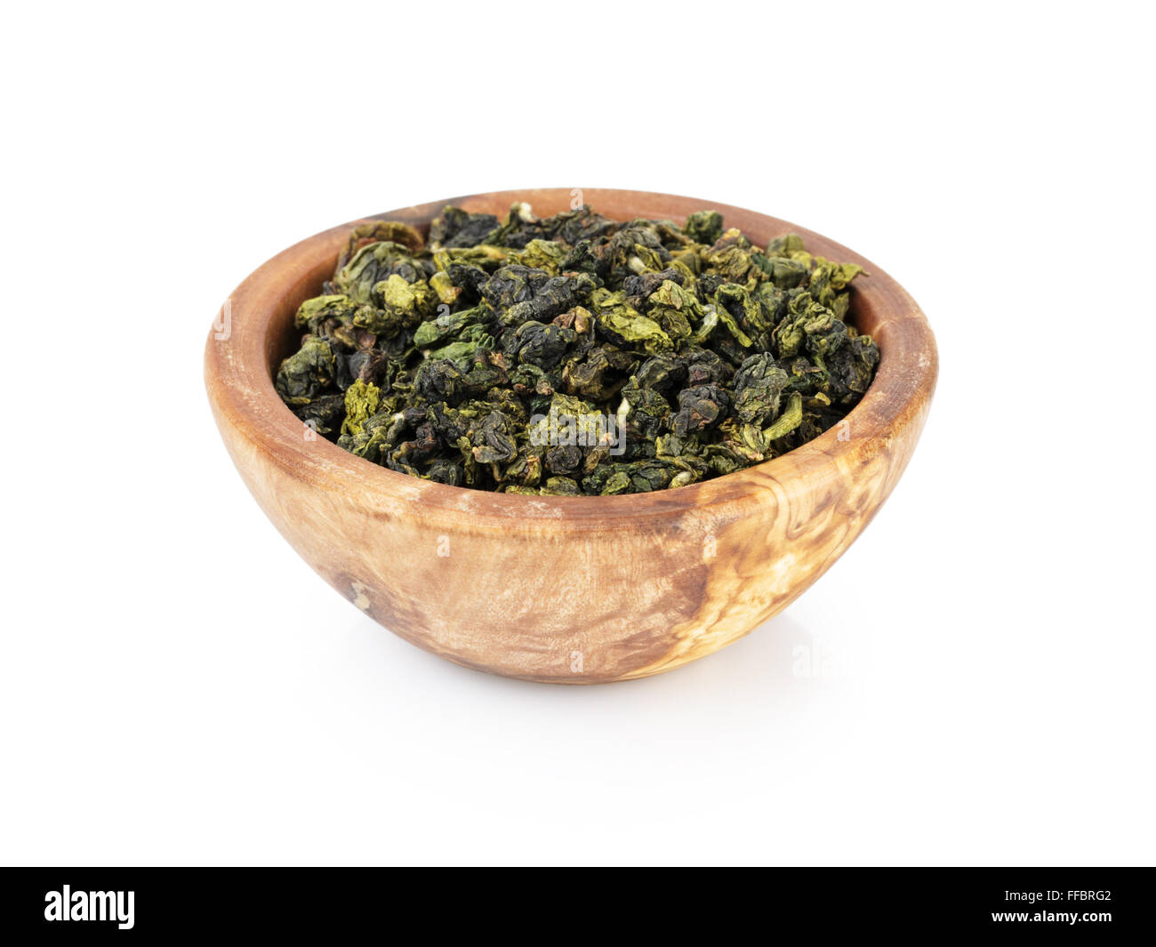 oolong green tea heap in bowl, isolated on white Stock Photo
