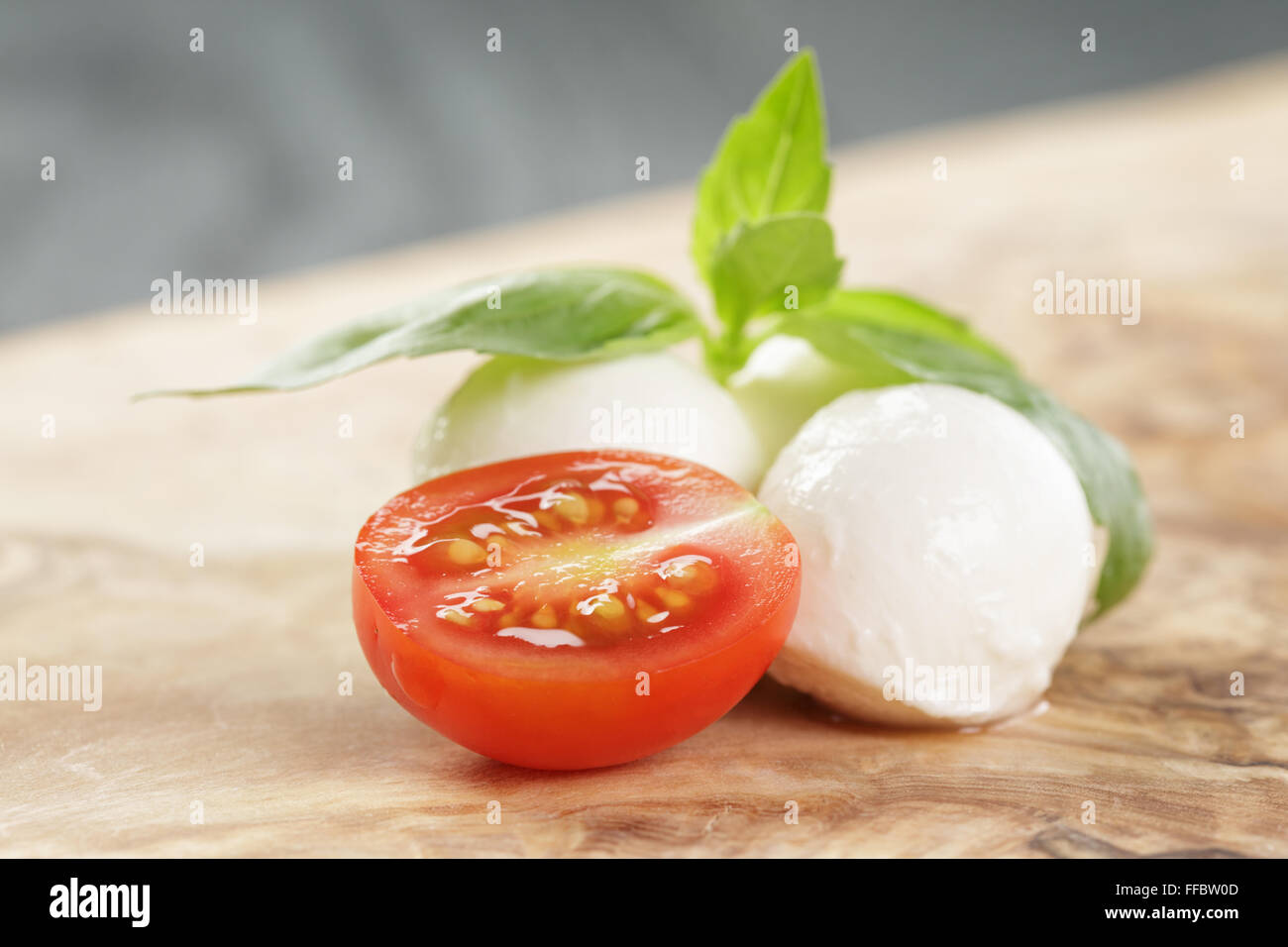 small mozzarella balls with plum tomato Stock Photo Alamy