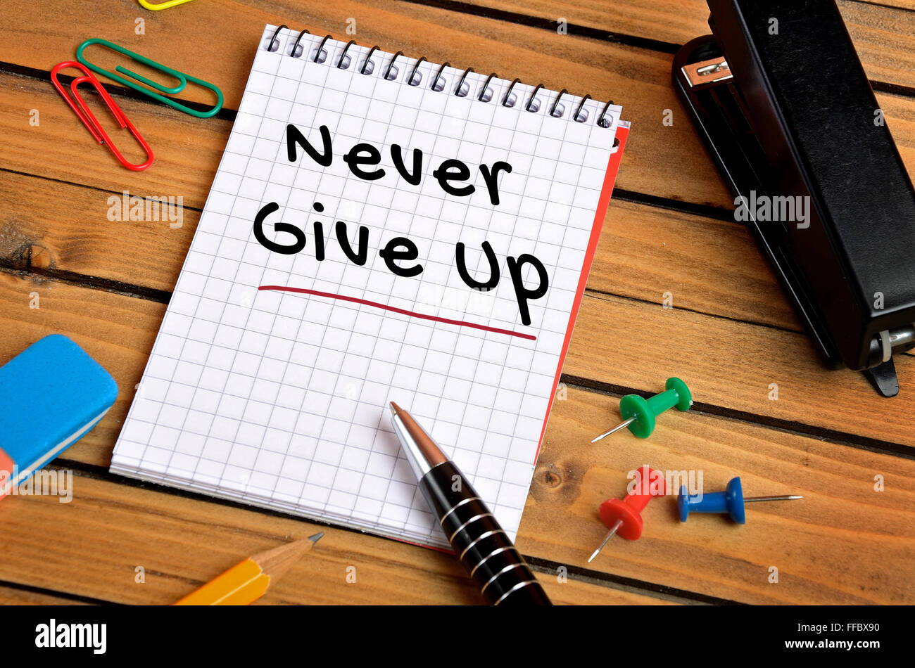 never-give-up-word-on-notebook-stock-photo-alamy