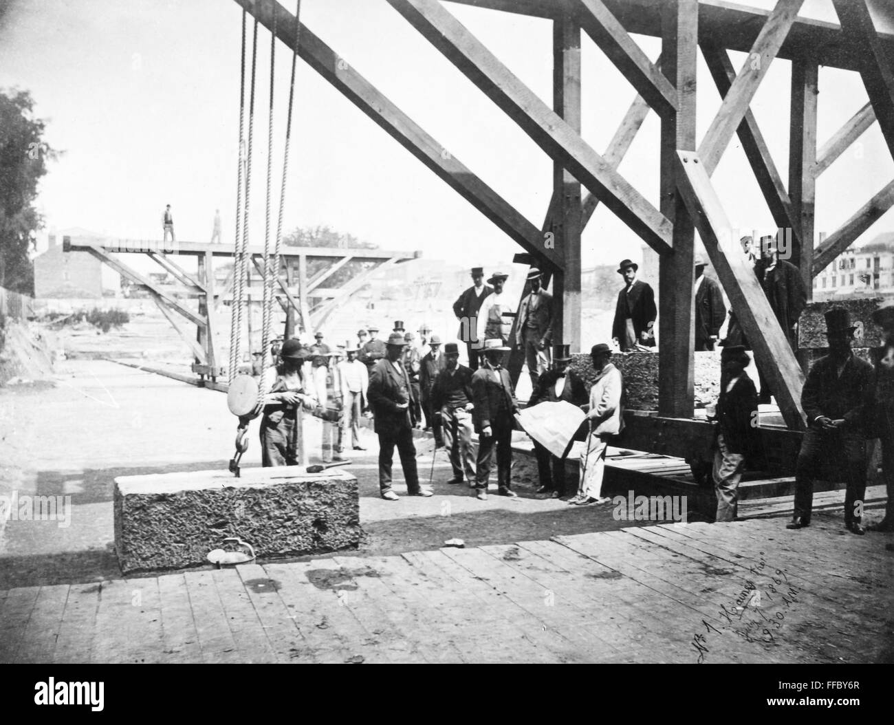 ALBANY: STATE CAPITOL. /nRope and pulley placing a granite block on the foundation of the New York State Capitol building at Albany. Photographed 7 July 1869. Stock Photo
