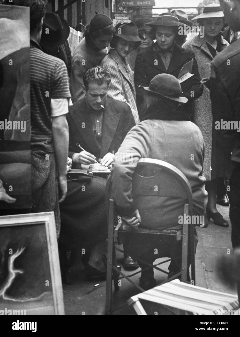 GREENWICH VILLAGE, c1955. /nAn artist sketching portraits near