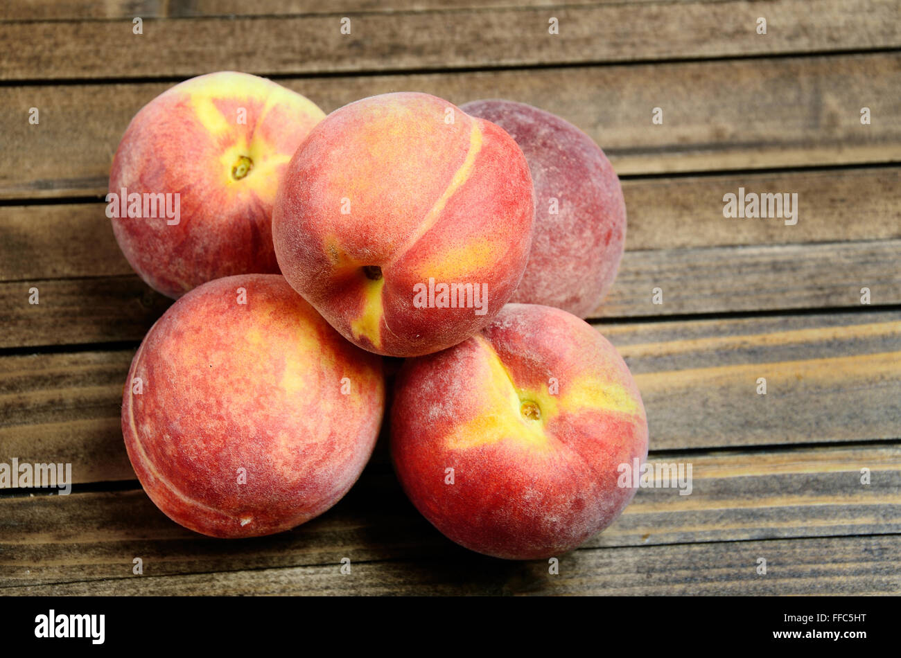 Peaches fruit on wooden table Stock Photo