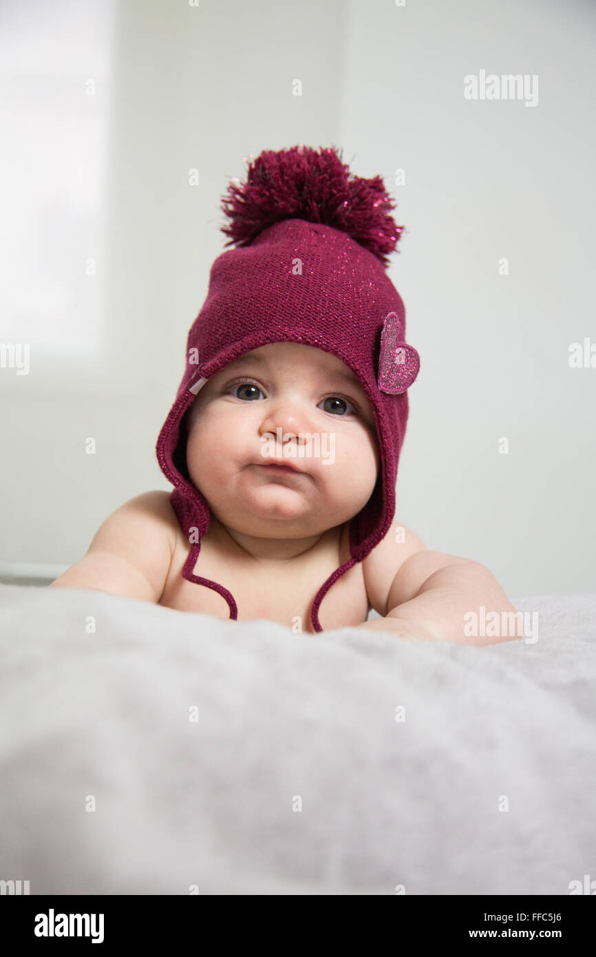 cute baby's portrait with chubby cheek's lying in bed Stock Photo Alamy